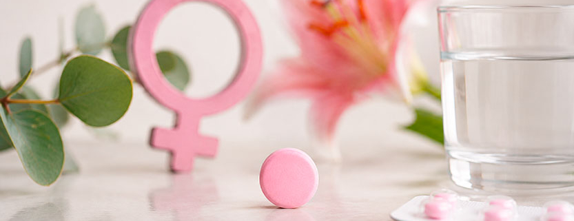 Compressa rosa con simbolo femminile, immagine rappresentativa dei farmaci per i disturbi della sessualità femminile.